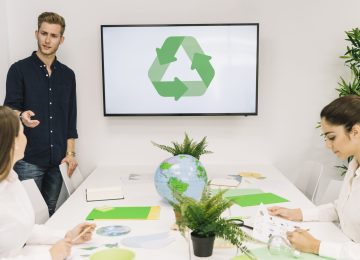 businessman-discussing-recycle-concept-with-his-female-colleague